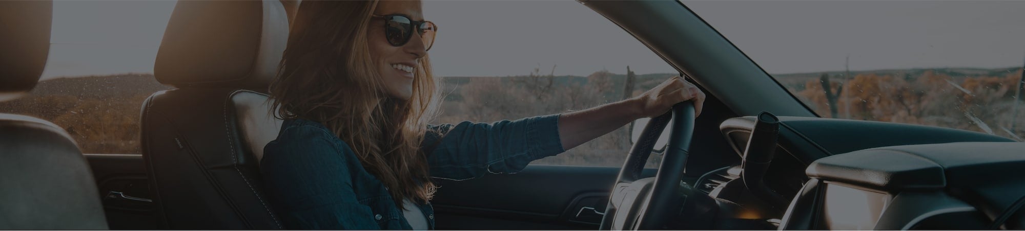 image of a woman driving a car